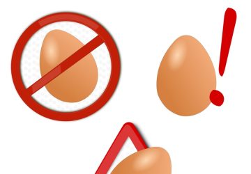 intolleranza alle uova, disegno di uova con simboli di attenzione e divieto