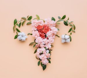 Endometriosi, disegno di un utero con fiori e foglie